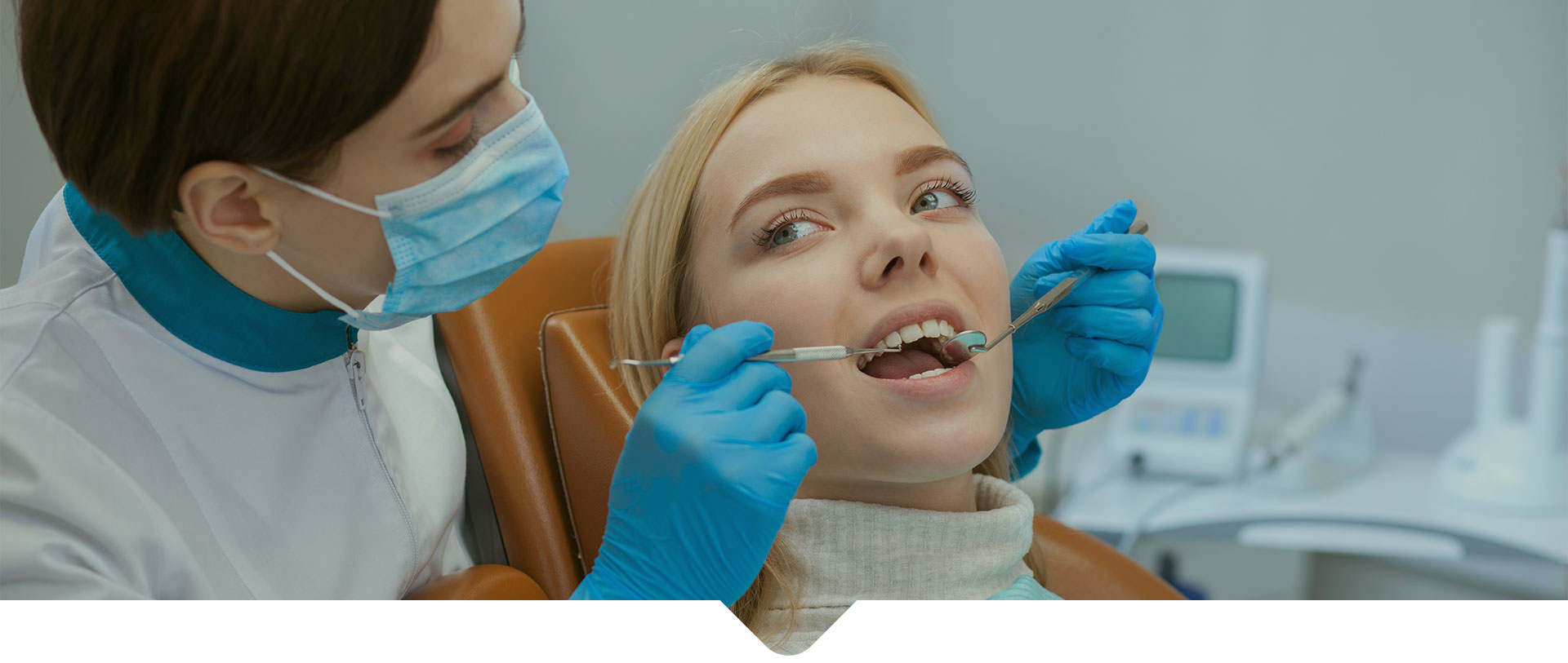 A female patient getting dental examination